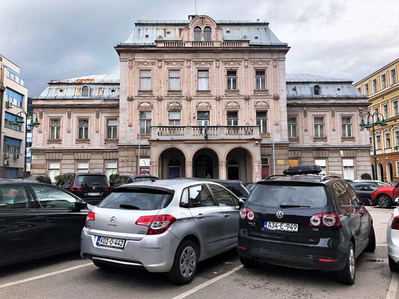 cars parked in front of building