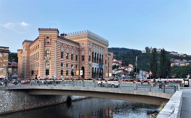 bridge over canal with pseudo-Moorish building in background