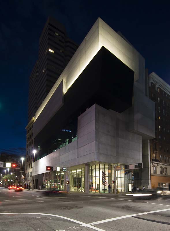 glass and concrete building at intersection