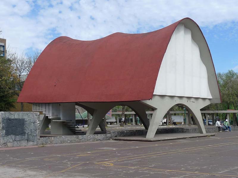 arched red roofed structure atop three concrete arches